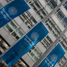 University flags in front of the institute building in Keplerstraße